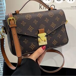 Stylish Brown Crossbody Bag with Gold Accents